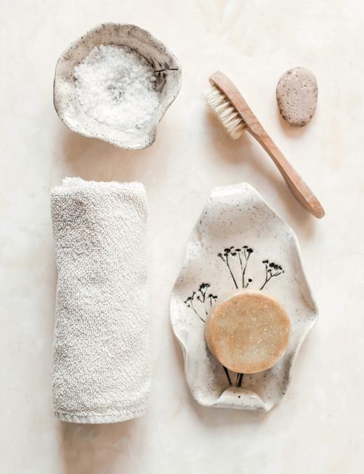 Rolled face towel with bath salts