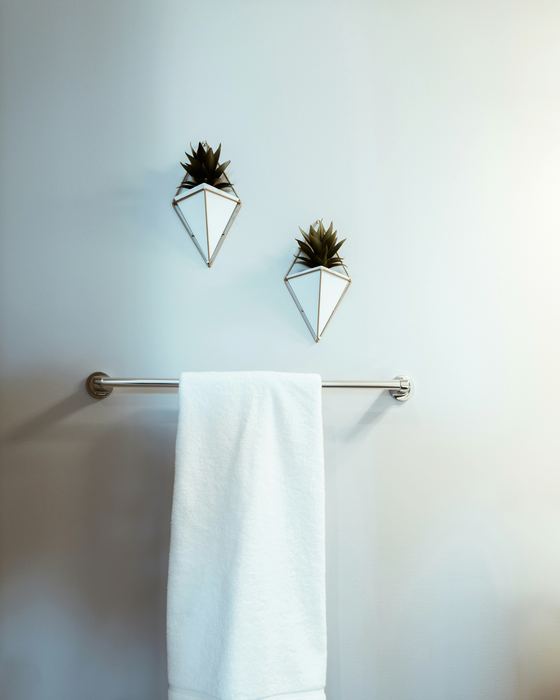 White towel on a chrome towel bar